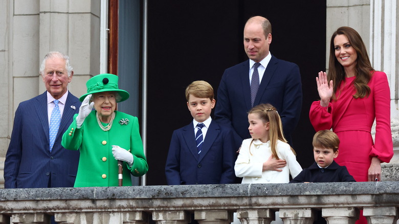 The royal family waving from the palace balcony